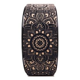 Yoga Design Lab Mandala Yoga Wheel in black with intricate gold mandala pattern, circular cork and foam fitness accessory
