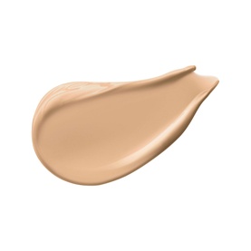 IT Cosmetics Bye Bye Under Eye Concealer swatch in a warm beige nude tone, shown as a teardrop-shaped texture smear