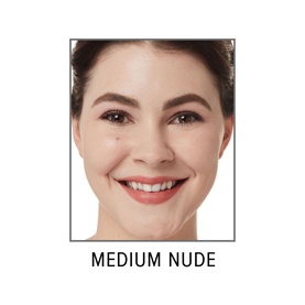 Model wearing IT COSMETICS Bye Bye Under Eye Concealer in shade Medium Nude, shown in a close-up complexion shot