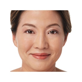Model wearing IT COSMETICS Bye Bye Under Eye Concealer, close-up showing smooth, even complexion with concealed under-eye area