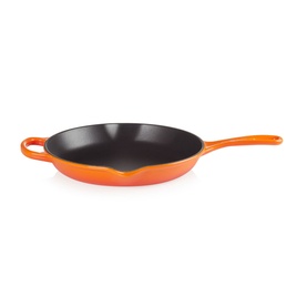 Le Creuset Signature Cast Iron Frying Pan 26cm in orange, with black enamel interior and long metal handle, shown from above at an angle