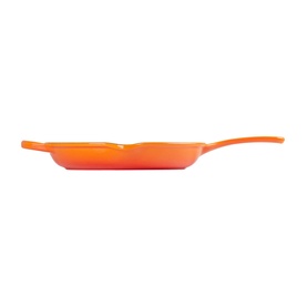 Le Creuset Signature Cast Iron Frying Pan 26cm in orange, shown from side profile highlighting long metal handle and shallow ribbed base