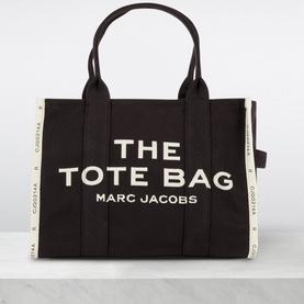 Marc Jacobs The Jacquard Large Tote Bag in black canvas with cream logo lettering, jacquard side panels, and dual top handles
