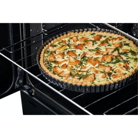 Rangemaster Professional+ 110 Dual Fuel Rangecooker oven interior with a golden chicken and herb quiche baking on the rack