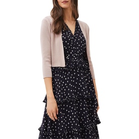 Model wearing Phase Eight Salma Light Knit Jacket in cream, crop length, 3/4 sleeves, styled over a navy polka dot dress
