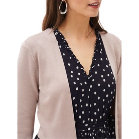 Model wearing Phase Eight Salma Light Knit Jacket in cream, cropped edge-to-edge style, styled over a navy polka dot dress