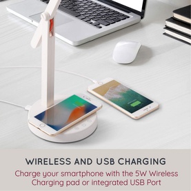 iStar Wireless Charging Lamp in white, styled as a desk fan lamp with smartphone on charging pad and second phone charging via USB port