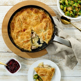 Zyliss Ultimate Pro 24cm Frying Pan styled with golden pastry pie, served alongside cranberry sauce and roasted Brussels sprouts