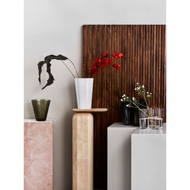 Iittala Aalto Vase 251mm in white with red orchid stems, styled alongside olive and dark glass vases on stone plinths