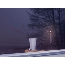 Iittala Aalto Vase 251mm in white, styled on a wooden tray with a lit taper candle against a misty winter window backdrop
