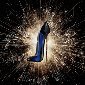 Carolina Herrera Good Girl Eau de Parfum 50ml, deep blue stiletto-shaped bottle with black heel, surrounded by dramatic sparks