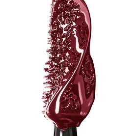 YSL Lash Clash Extreme Volume Mascara wand showing dense bristle brush with deep burgundy-black formula swatch