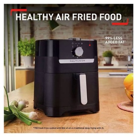 Tefal EasyFry Classic 1.2kg Air Fryer & Grill in black, shown on wooden surface with fresh vegetables and healthy food messaging