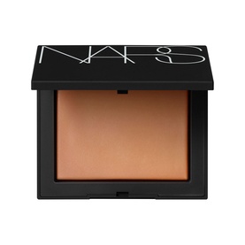 NARS Light Reflecting Setting Powder Pressed in Sunstone, compact with black lid showing warm golden-tan pressed powder pan