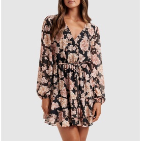 Model wearing Forever New Jasmine Skater Dress in gold floral print, featuring V-neck, sheer blouson sleeves, elasticated waist with tie belt