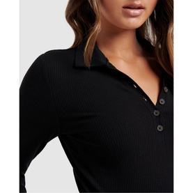 Model wearing Forever New Julia Long Sleeve Polo Top in black, showing ribbed texture, collared neckline and button-through front detail