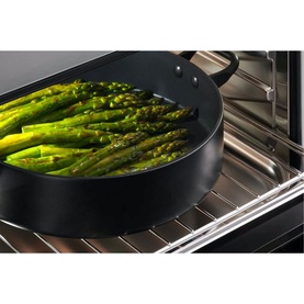 Fisher & Paykel 37L 900W Built-in Combination Microwave interior with black pan of asparagus cooking on oven rack