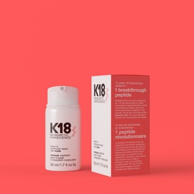 K18 Leave-In Molecular Repair Mask 50ml pump bottle shown alongside product box on coral background