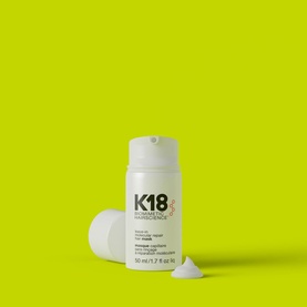 K18 Leave-In Molecular Repair Hair Mask 50ml in white bottle on lime green background with open cap and product sample shown