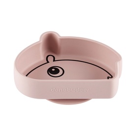 Done By Deer Ozzo Stick & Stay Bowl in light pink silicone, bear-face design with suction base, viewed from above at an angle