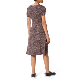 Model wearing Hobbs Simmy Dress in blue, all-over print, V-neckline, short sleeves, knee-length flared skirt, back view