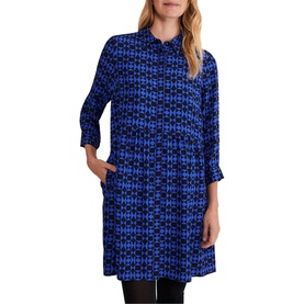 Model wearing Phase Eight Bregitta Geo Print Shirt Dress in black, featuring blue geometric print, bracelet sleeves, collar, and button fastening