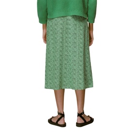 Model wearing Whistles Ink Leopard Button Front Skirt in green midi length with subtle print, styled with green knit and black sandals