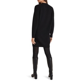 Model wearing Phase Eight Reeva Cosy Button Detail Dress in black, high neck, long sleeves, styled with black tights and knee-high boots
