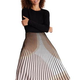 Model wearing Phase Eight Silvia Fit And Flare Dress in black and cream with gradient stripe pleated skirt and long-sleeve plain bodice