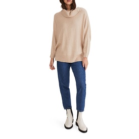 Model wearing Phase Eight Nola Zip Neck Chunky Relaxed Sweater in cream with blue straight-leg jeans and white ankle boots