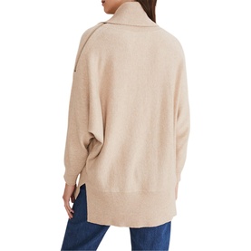 Model wearing Phase Eight Nola Zip Neck Chunky Relaxed Sweater in cream, shown from behind, with blue jeans