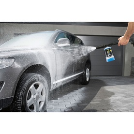 Karcher 3 In 1 Car Shampoo 1L being applied via pressure washer lance to a foam-covered car on a driveway