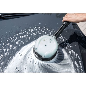 Karcher 3 In 1 Car Shampoo 1L being applied to a dark car bonnet using a rotary brush head, creating thick foam lather