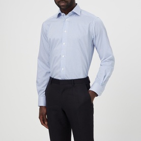 Model wearing Eton Bengal Striped Regular Fit Shirt in blue, kent collar, button front, long sleeves, styled with dark trousers