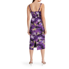 Model wearing Phase Eight Adelita Abstract Print Dress in purple floral print, back view, fitted silhouette with back split, styled with silver heels