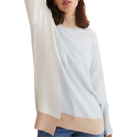Model wearing Phase Eight Mariella Cosy Asymmetric Sweater in blue, colour block high neck knit with ribbed camel and white trims, relaxed fit