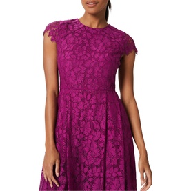 Model wearing Hobbs Rosaleen Dress in purple lace with round neck and capped sleeves, fitted bodice and flared skirt