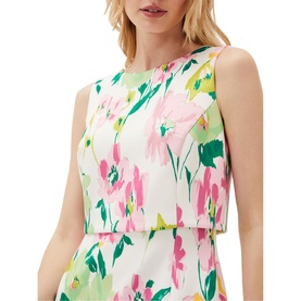 Model wearing Phase Eight Effie Floral Scuba Dress in cream with pink and green floral print, sleeveless overlay detail and boat neckline