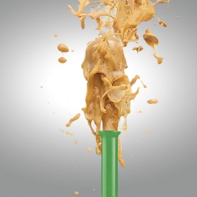 FAO Schwarz Rocket Ship Reaction Chamber science toy demonstrating explosive peanut butter-like foam eruption from green tube launcher