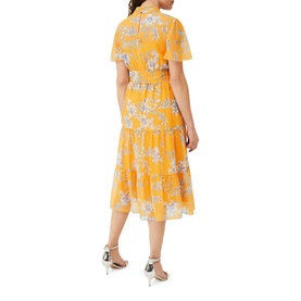 Model wearing Phase Eight Emmalyn Tiered Georgette Dress in yellow floral print, midi length, short sleeves, styled with silver heels