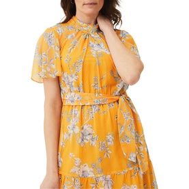 Model wearing Phase Eight Emmalyn Tiered Georgette Dress in yellow floral print with short flutter sleeves and self-tie waist belt