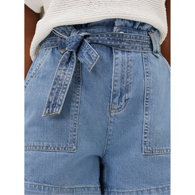 Model wearing Phase Eight Pollie Cargo Shorts in blue denim with paperbag waist, tie belt, and patch pockets, styled with a white knit top