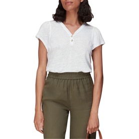 Model wearing Whistles Cada Button Linen Blend T-Shirt in white, short sleeve V-neck with button detail, styled with olive green trousers