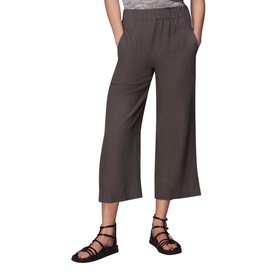 Model wearing Whistles Linen Trousers in black, high rise cropped wide leg style, paired with black strappy flat sandals