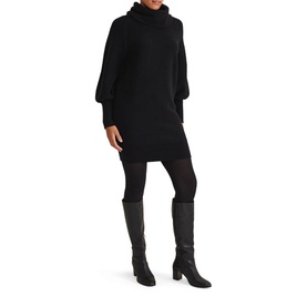 Model wearing Phase Eight Dahlie Cowl Neck Dress in black with long sleeves and relaxed fit, styled with black tights and knee-high boots