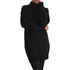 Model wearing Phase Eight Dahlie Cowl Neck Dress in black, long sleeve relaxed fit knit with high neck and ribbed trims, styled with black tights