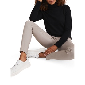 Model wearing Phase Eight Amina Jeggings in brown with exposed side zip, styled with black roll-neck jumper and white trainers