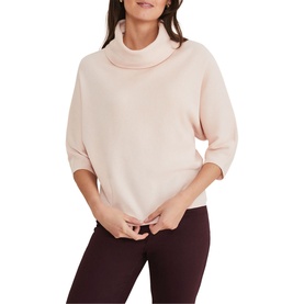 Model wearing Phase Eight Camillan Cowl Neck Sweater in pink with cowl neck and three-quarter sleeves, styled with dark trousers