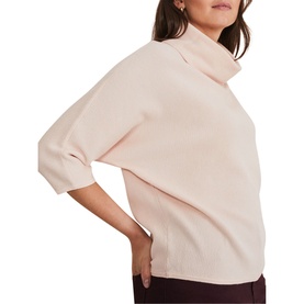 Model wearing Phase Eight Camillan Cowl Neck Sweater in pink, featuring cowl neck, fine rib knit and three-quarter sleeves, styled with dark trousers
