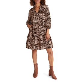 Model wearing Phase Eight Kesia Hearts Swing Dress in cream heart print, V-neck, bracelet sleeves, tiered skirt, styled with tan ankle boots